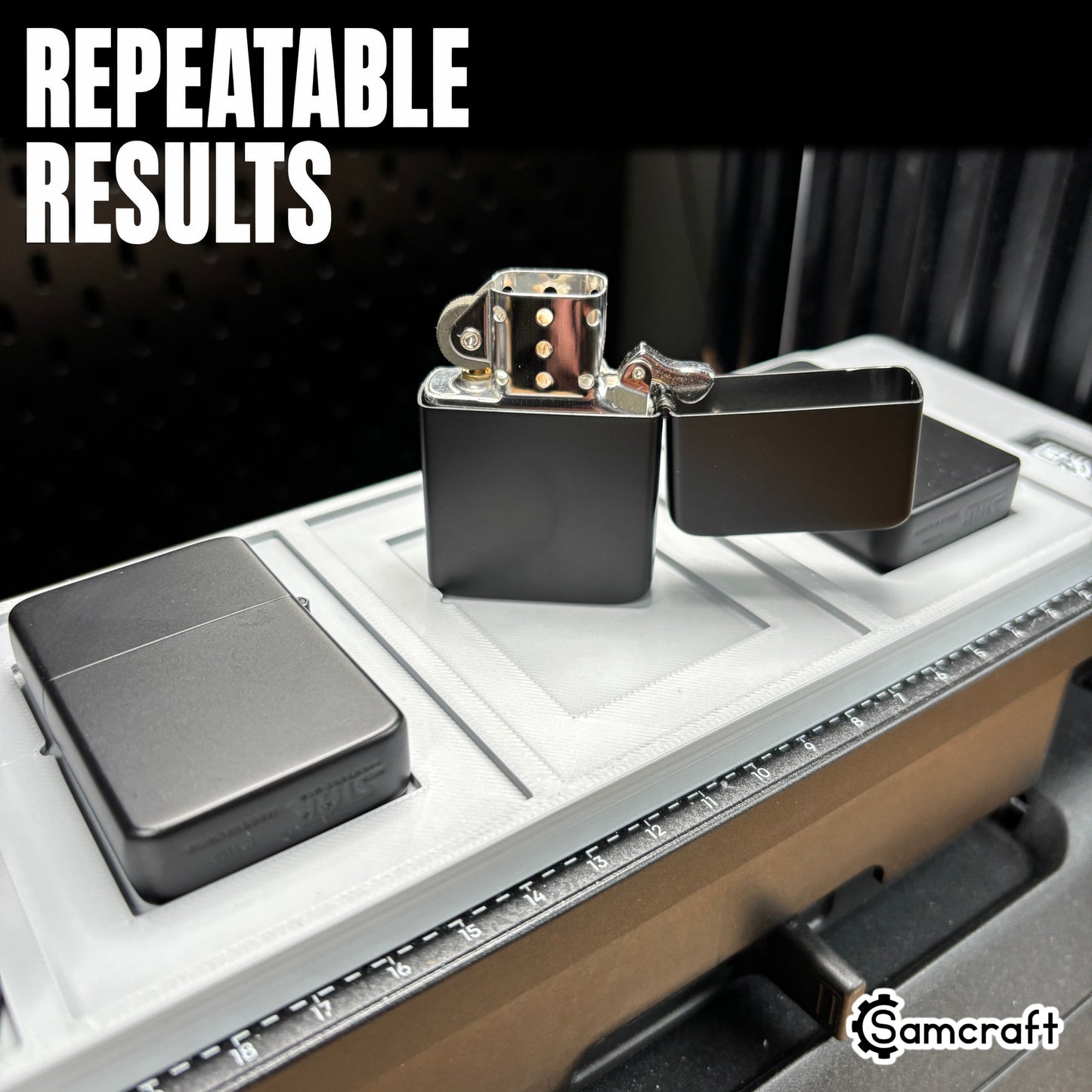 Detail of an open chrome flip-top lighter standing in the Samcraft jig alongside matte black lighters, showing repeatable results on the eufyMake E1 print bed.