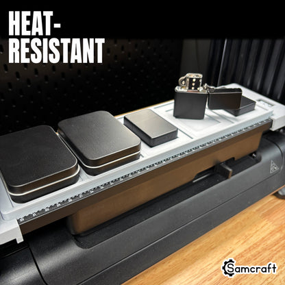 Heat-resistant Samcraft Flip Top Lighter Jig holding matte black flip-top lighters in a gray tray with alignment ruler on the eufyMake E1 UV printer.