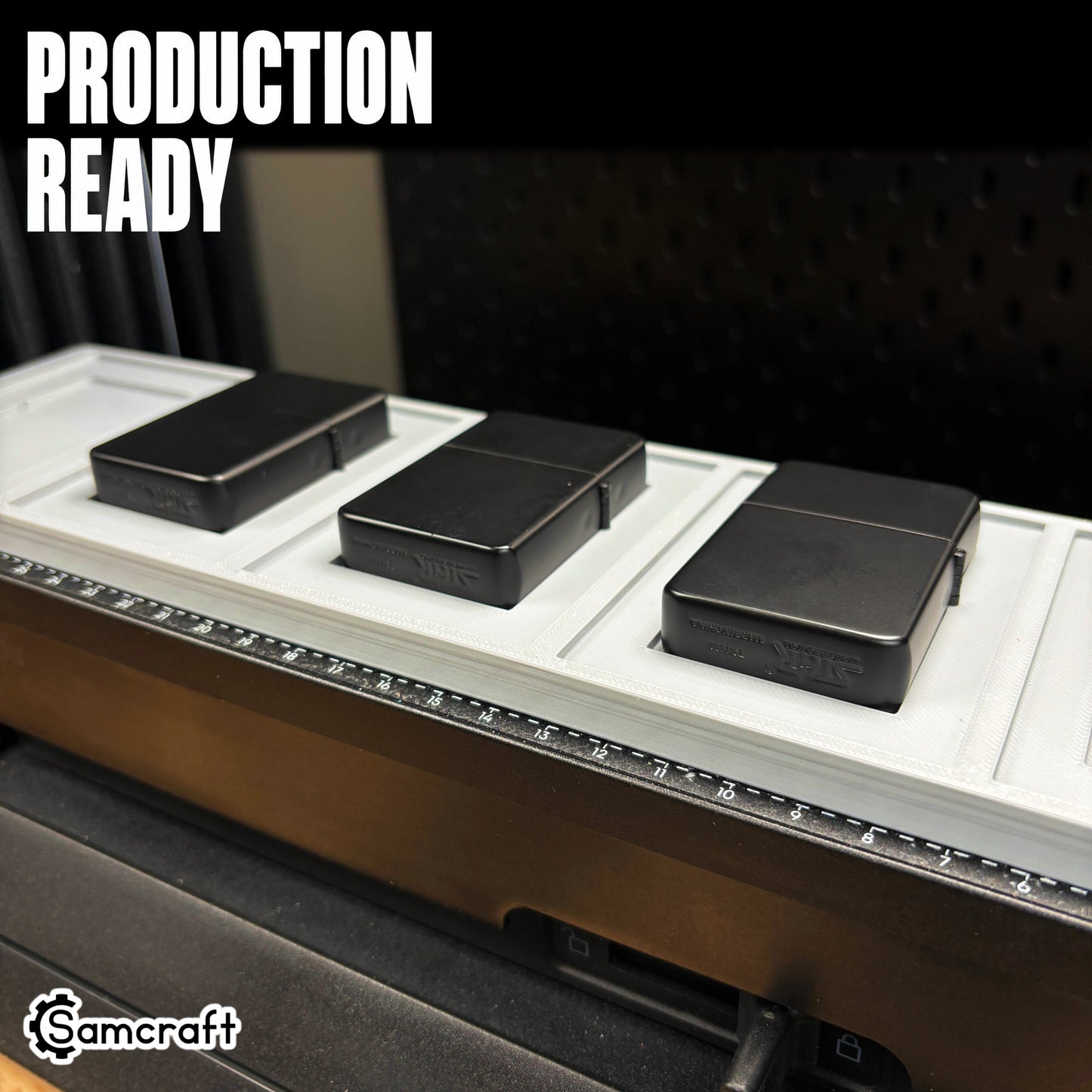 Production-ready Samcraft Flip Top Lighter Jig with matte black flip-top lighters seated in recessed pockets on the eufyMake E1 UV printer bed.