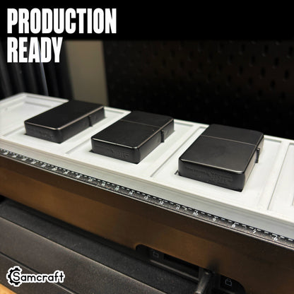 Production-ready Samcraft Flip Top Lighter Jig with matte black flip-top lighters seated in recessed pockets on the eufyMake E1 UV printer bed.