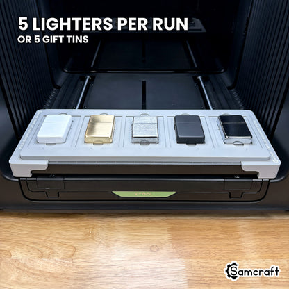 Samcraft lighter jig for the xTool Omni loaded with five flip top lighters, which also takes five gift tin cases.