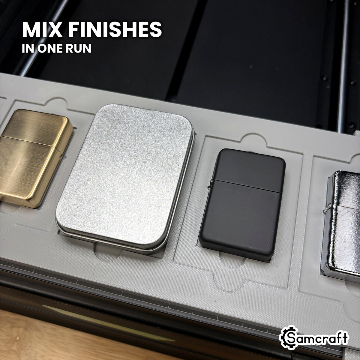 Brass, chrome, matte black and satin flip top lighters and a gift tin running together in one pass in the Samcraft xTool Omni jig.