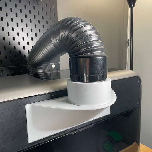 Samcraft fume extractor adapter fitted to the rear vent of a eufyMake E1 UV printer, with a flexible ducting hose attached and curving upward.