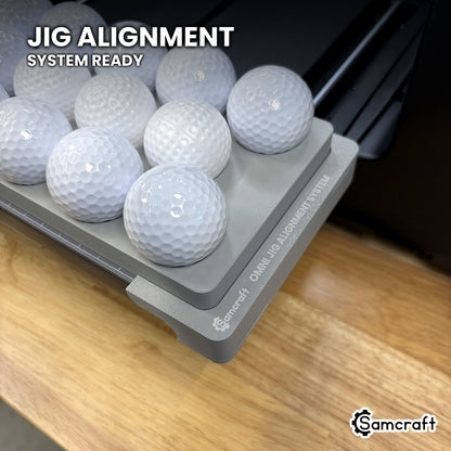 Samcraft golf ball jig seated on the optional Samcraft Omni Jig Alignment System on the xTool Omni printer bed.