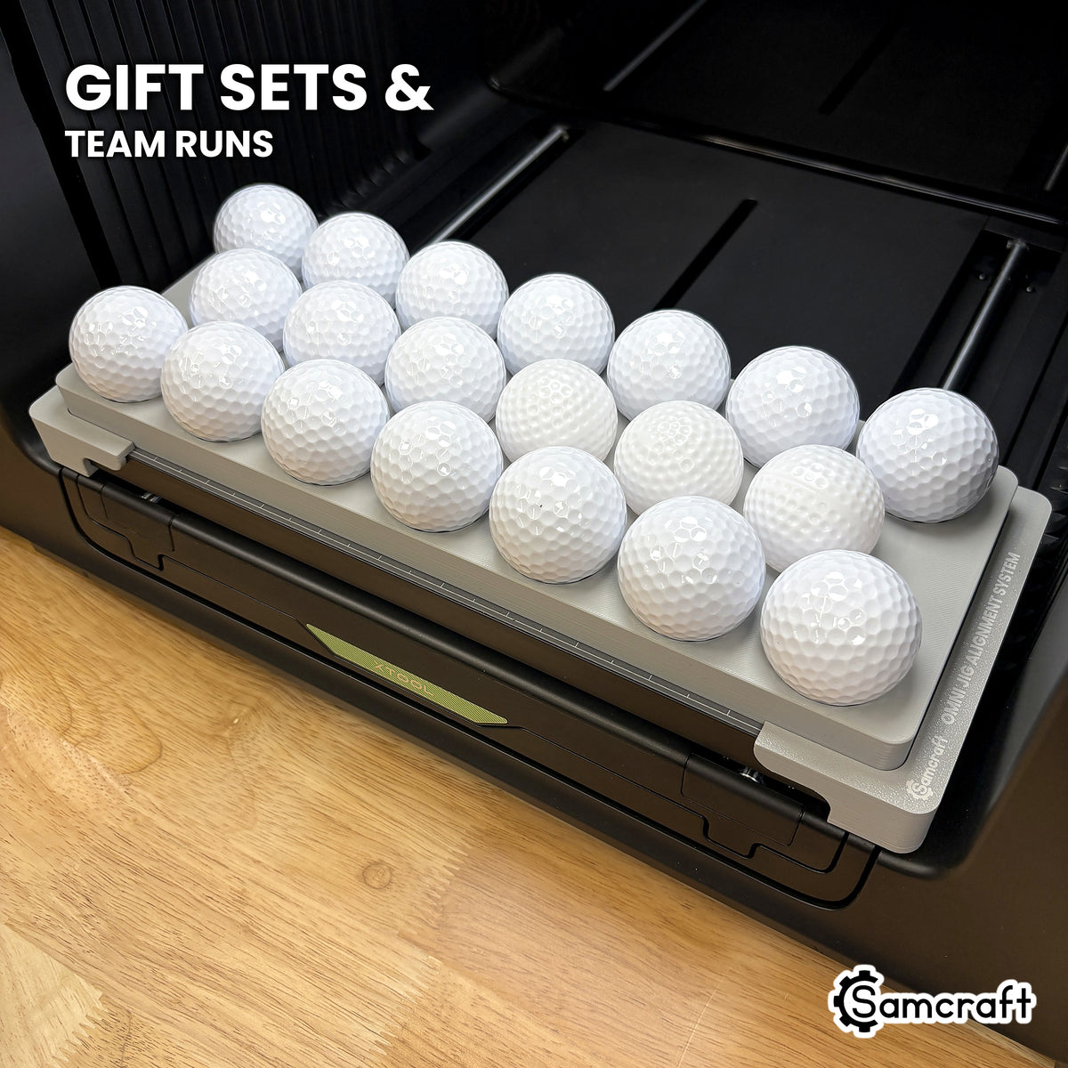 Samcraft xTool Omni golf ball jig filled with twenty white golf balls, ready for club gift sets and tournament team runs.