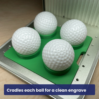 Golf balls seated in the Samcraft ball jig, each cradled square to the laser.