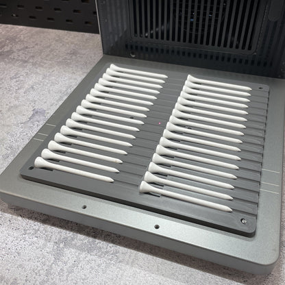 Samcraft golf tee jig on the xTool F2 Ultra bed, holding two full rows of golf tees.