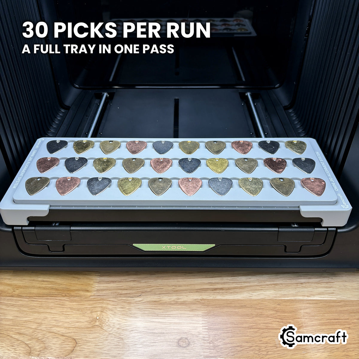 Samcraft guitar pick jig for the xTool Omni holding thirty guitar picks, a full tray printed in one job.
