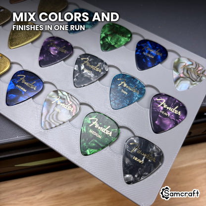 Mixed pick finishes printed together in the Samcraft xTool Omni guitar pick jig in a single run.