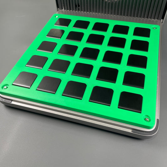 Samcraft green hat brim clip jig in an xTool F1 Ultra laser bed, holding a full grid of twenty-five black hat clips.