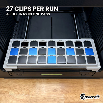 Samcraft hat clip jig for the xTool Omni loaded with twenty-seven hat brim clips, a full tray printed in one pass.
