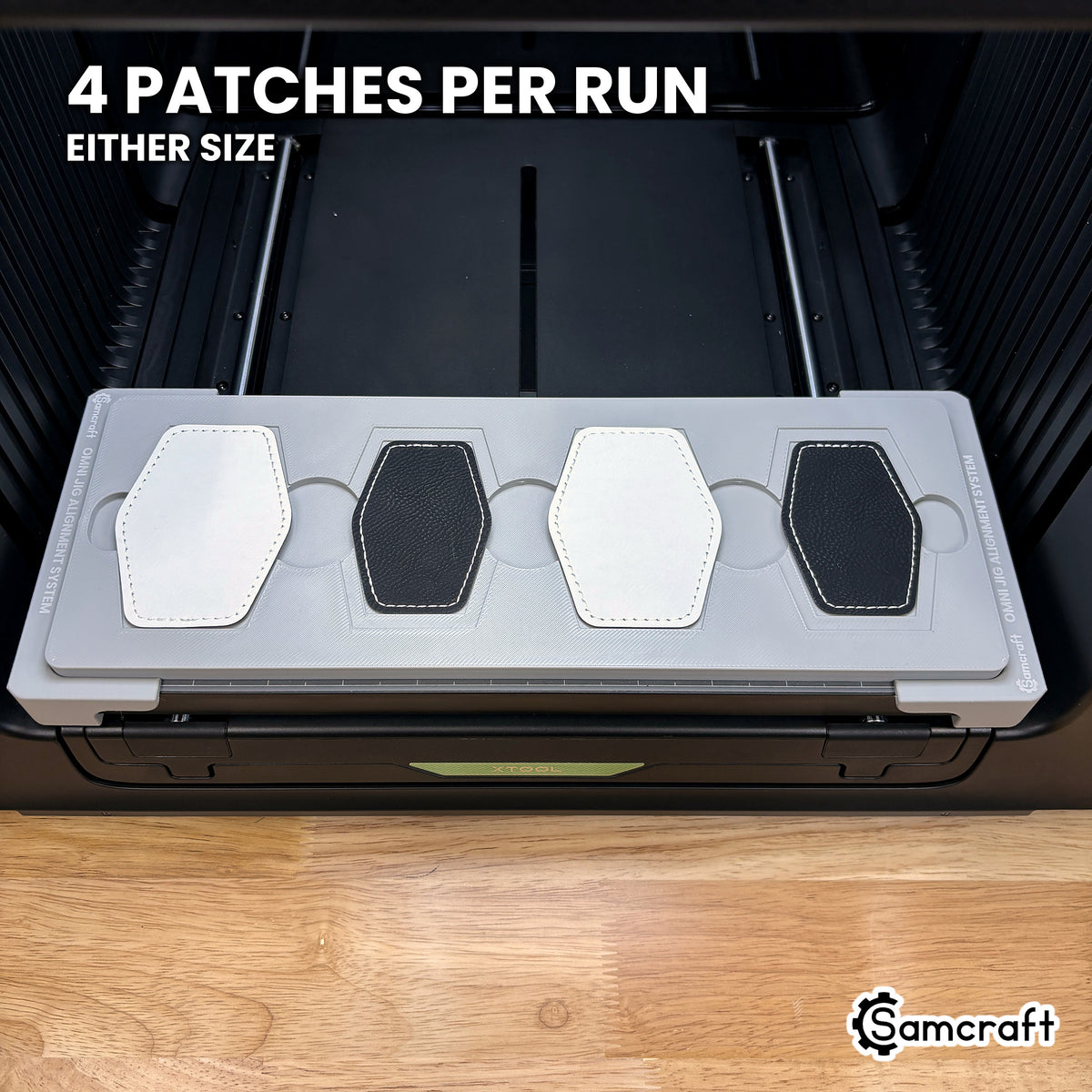 Samcraft hex patch jig for the xTool Omni loaded with four hexagon leatherette patches, a full set printed in one job.