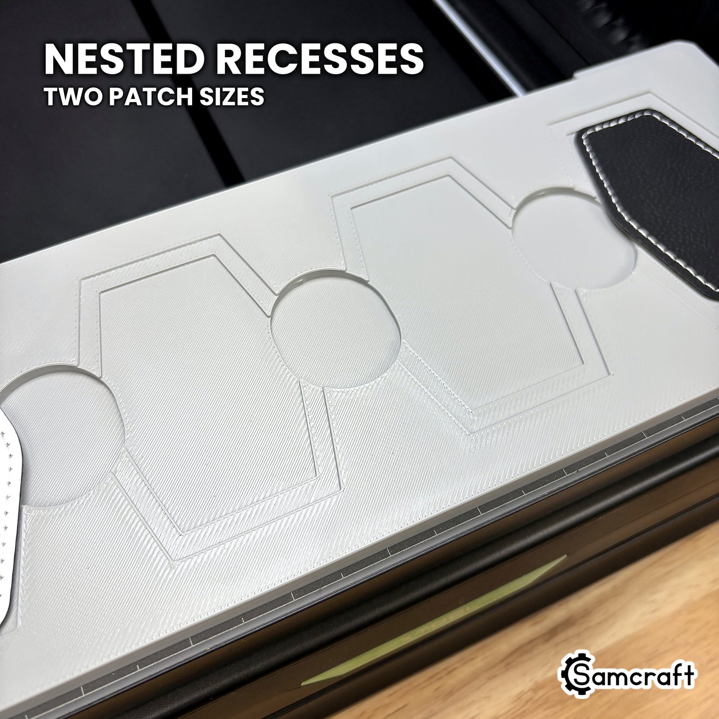 Close-up of the nested recesses in the Samcraft xTool Omni hex patch jig, the larger patch in the outer step and the smaller one in the inner.