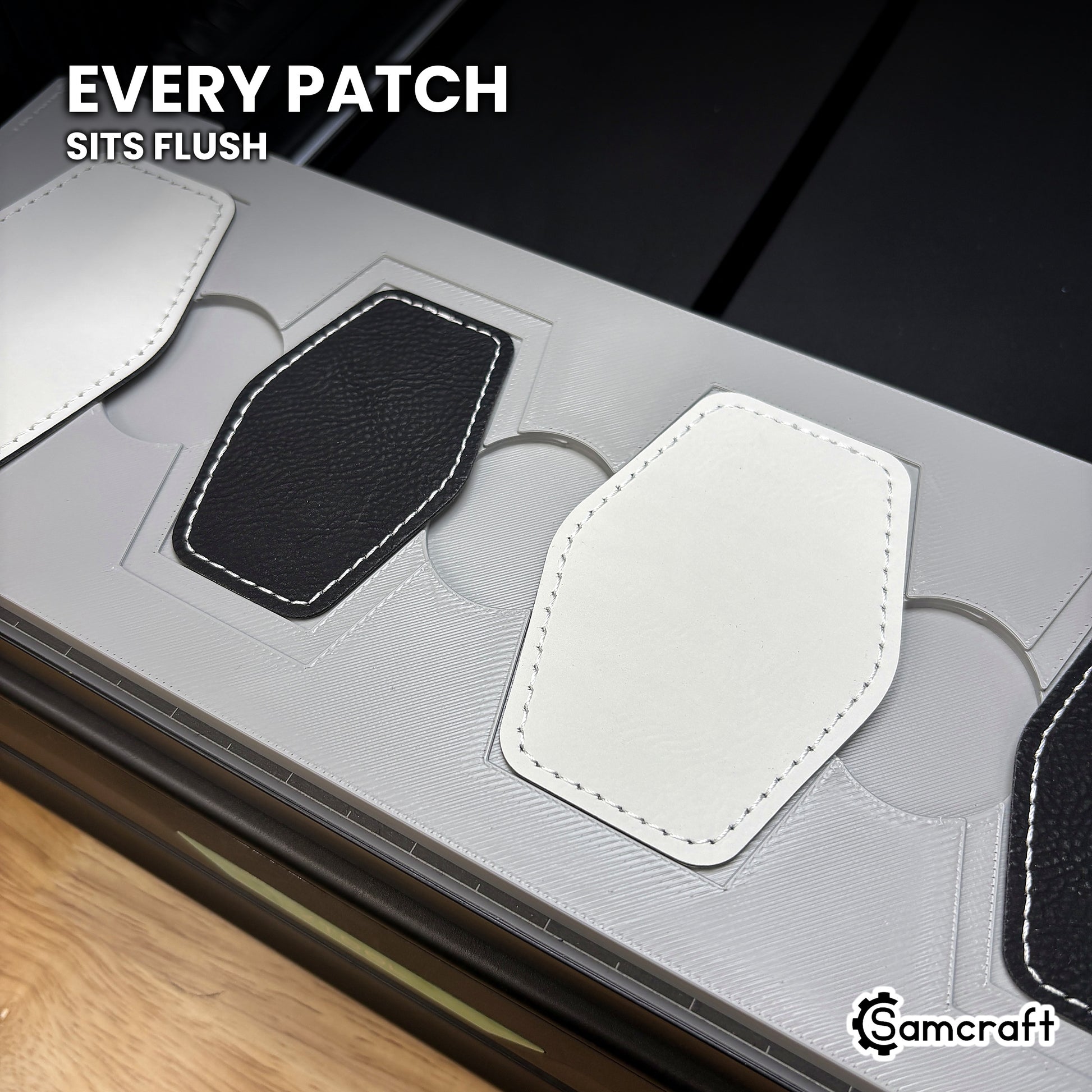Hexagon leatherette patch seated flush in the Samcraft xTool Omni jig pocket, level with the surrounding surface.