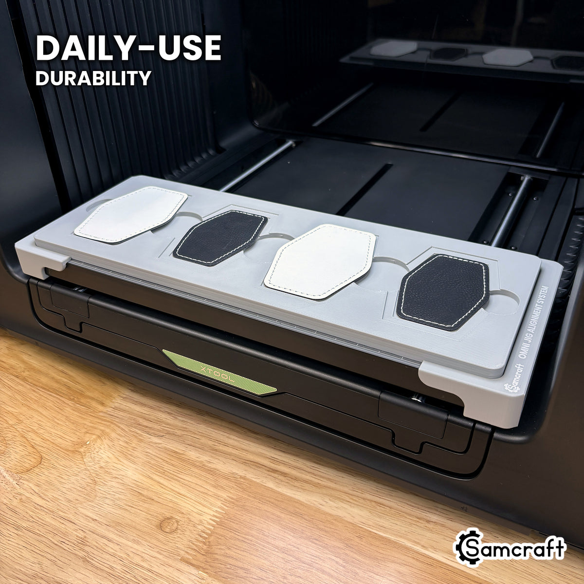 Samcraft xTool Omni hex patch jig held in hand, showing the durable one-piece construction built for daily use.
