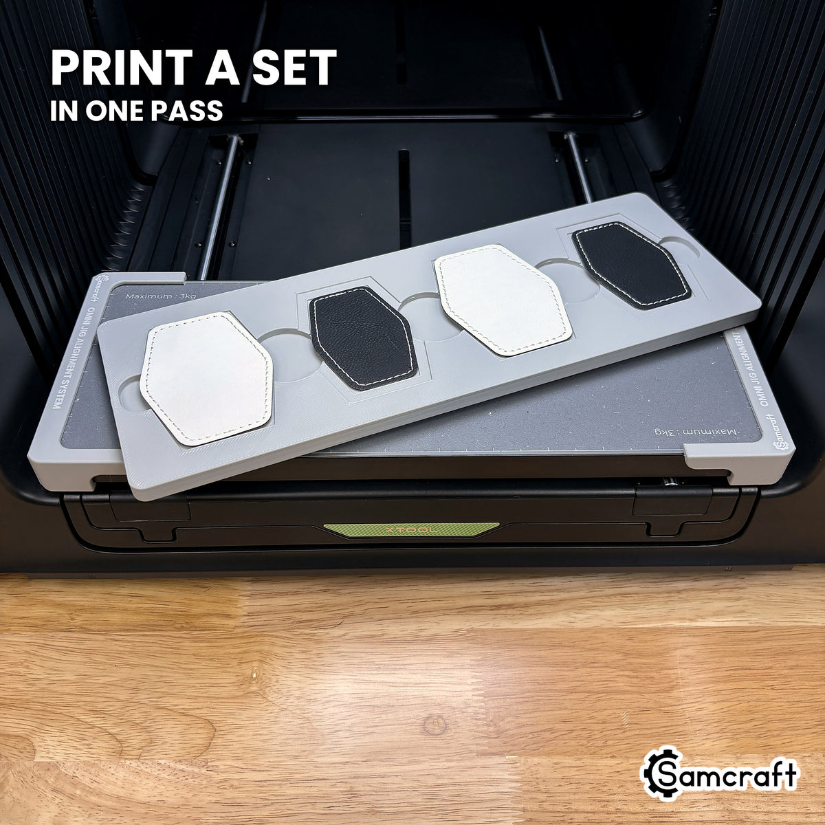 Four printed hexagon leatherette patches in the Samcraft xTool Omni jig, a matching set finished in a single job.