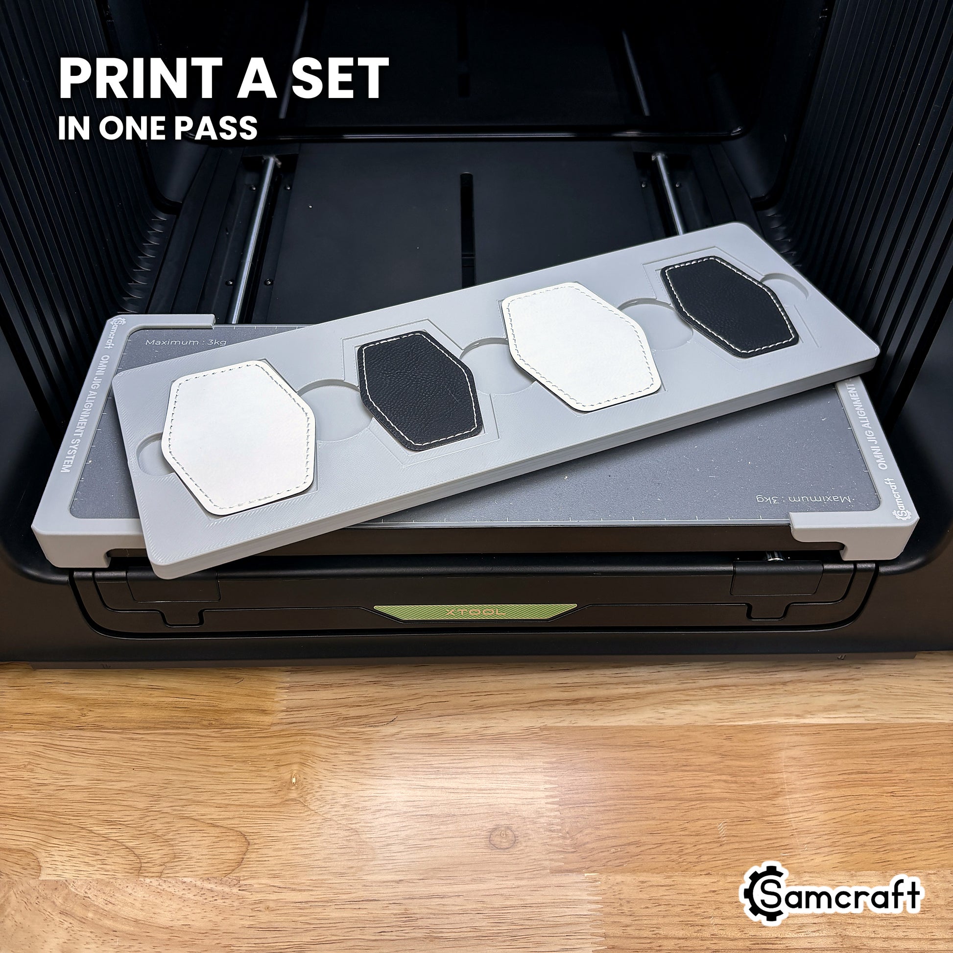 Four printed hexagon leatherette patches in the Samcraft xTool Omni jig, a matching set finished in a single job.