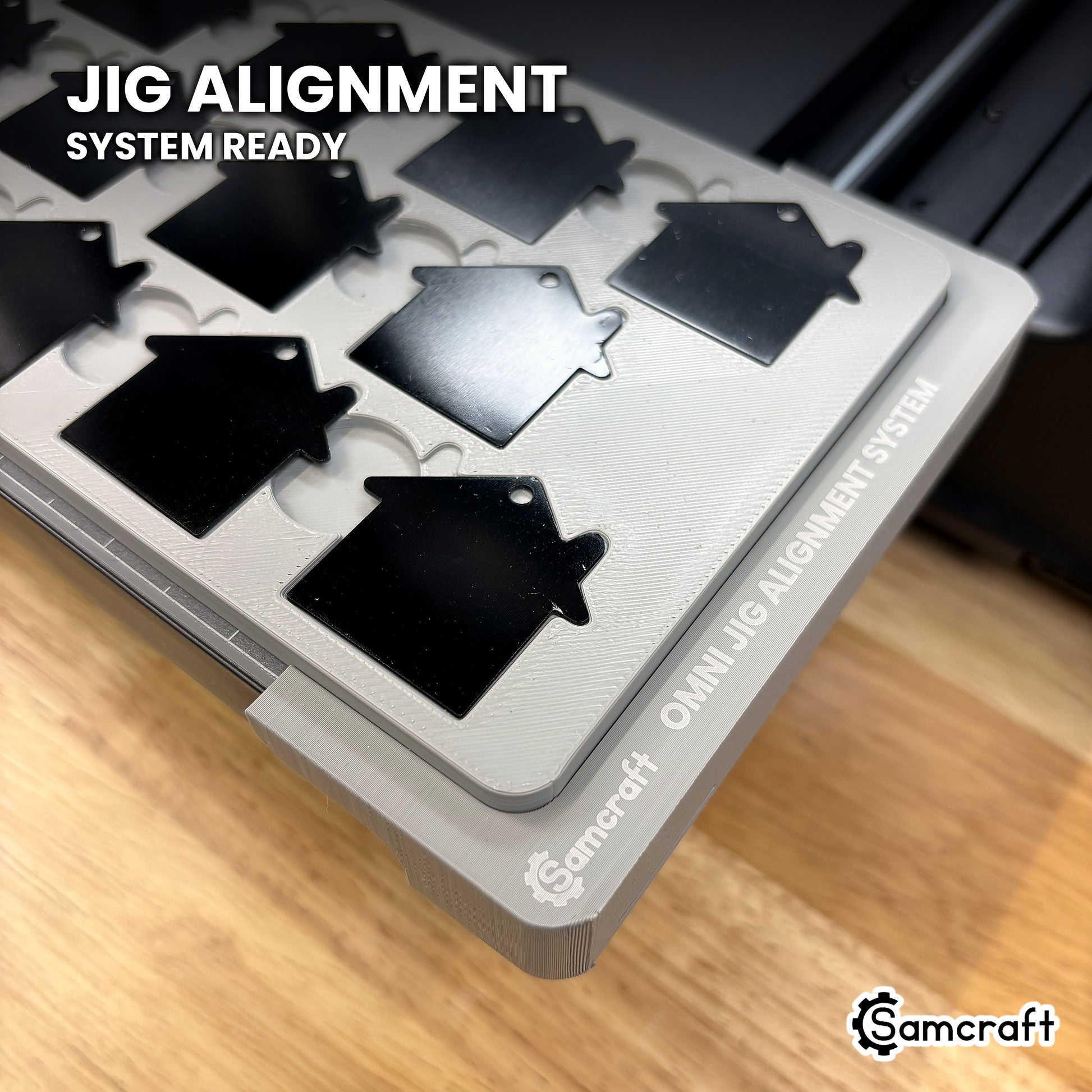Samcraft house tag jig seated on the optional Samcraft Omni Jig Alignment System, the alignment system lettering visible along the edge.