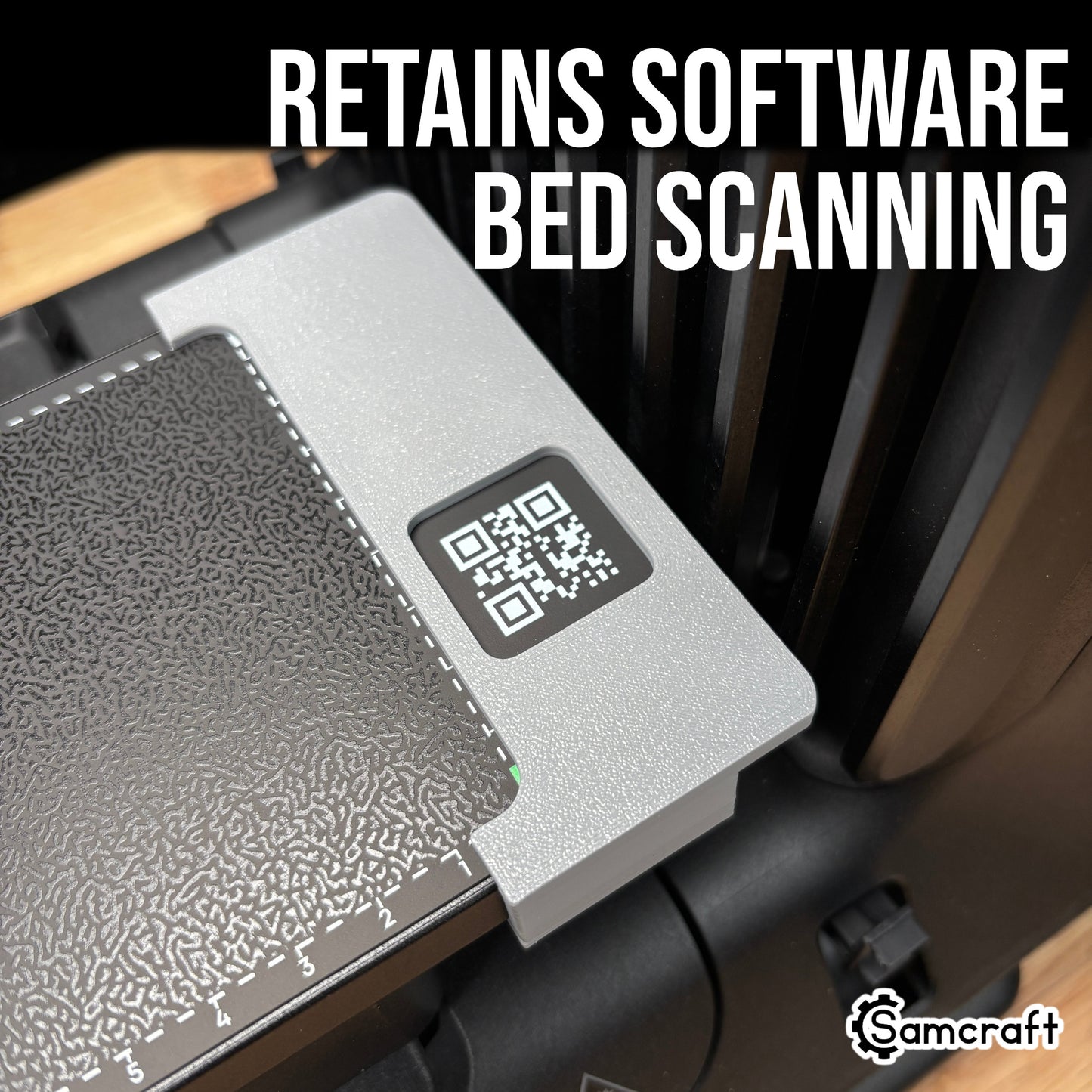 Jig Alignment System for the eufyMake E1 — close-up of the gray 3D-printed alignment bracket clipped to the corner of the printer's textured bed with the QR code left exposed, so the machine retains software bed scanning.