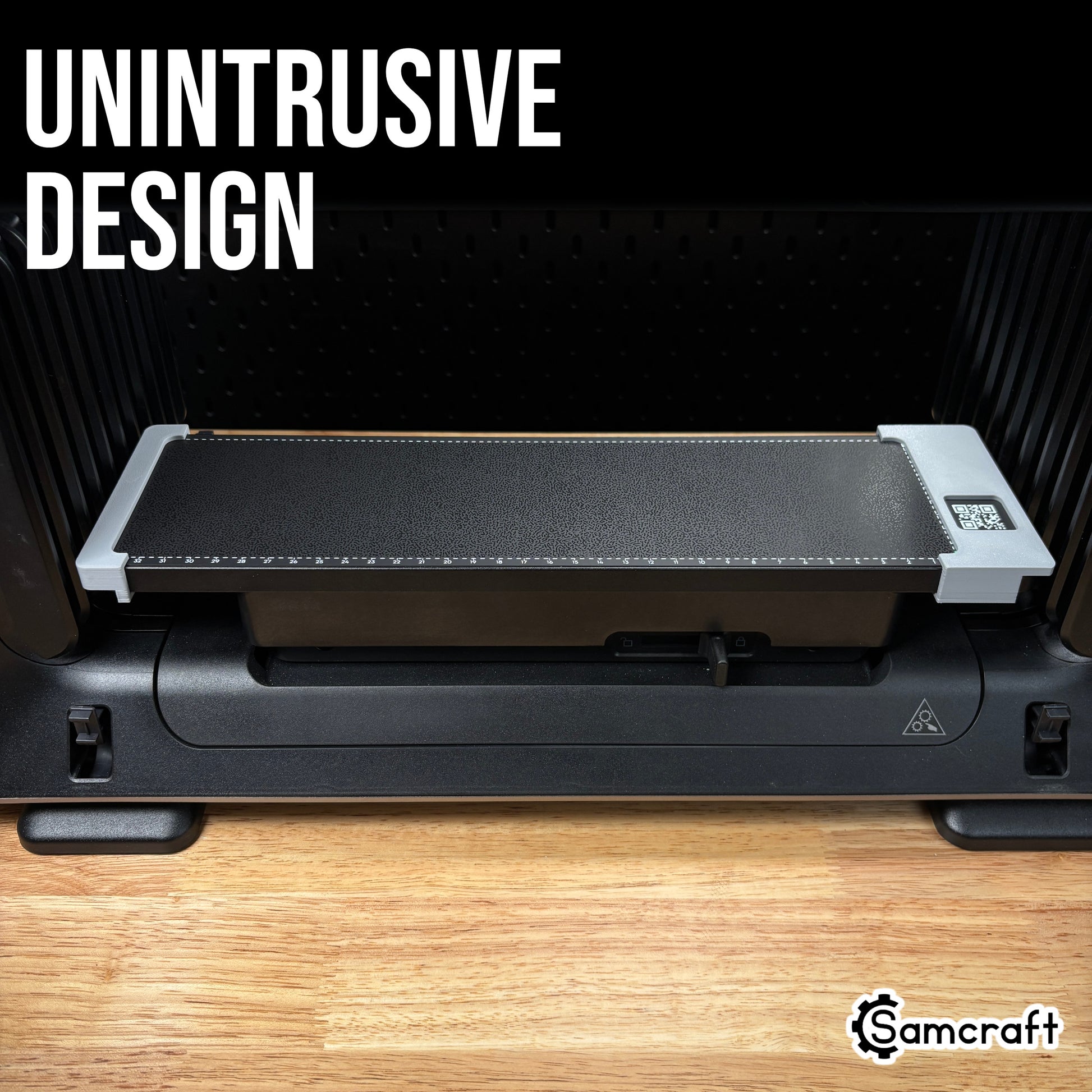 Jig Alignment System for the eufyMake E1 — straight-on view of the two gray 3D-printed alignment guides fitted to the left and right edges of the printer's black textured bed, showing the unintrusive design.