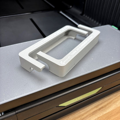 Both Samcraft Omni Jig Alignment System pieces seated on the xTool Omni Standard bed, showing the L-shaped profile that hooks over each end.