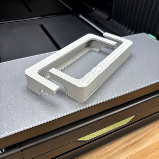 Both Samcraft Omni Jig Alignment System pieces seated on the xTool Omni Standard bed, showing the L-shaped profile that hooks over each end.