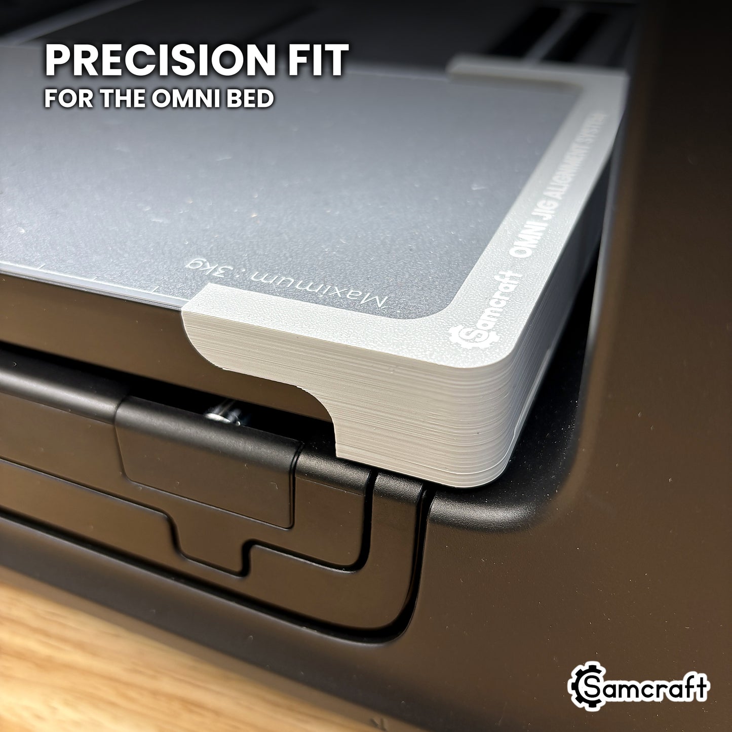 Close-up of a Samcraft alignment system piece seated precisely against the corner of the xTool Omni Standard bed.