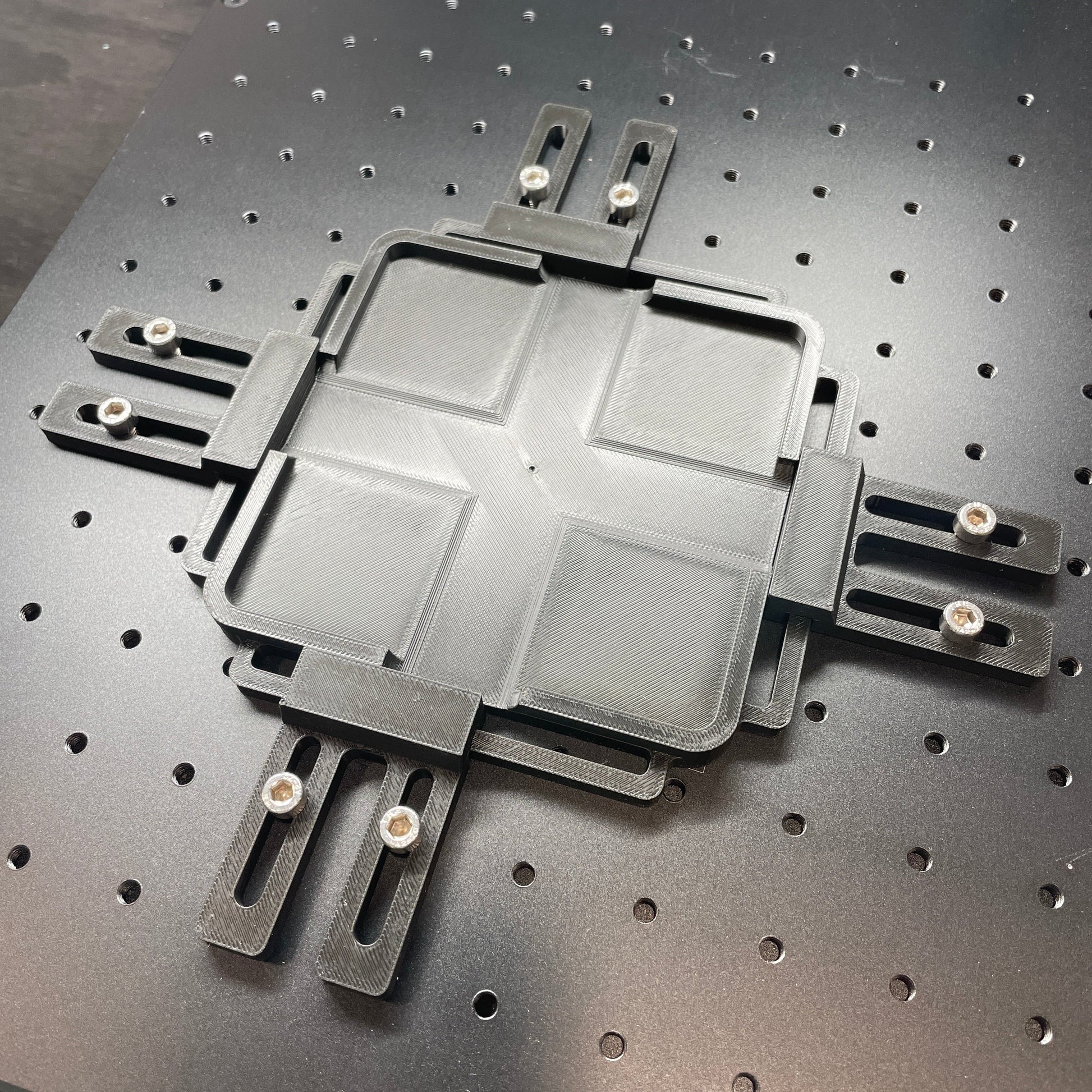 Samcraft jig baseplate mounted on a ComMarker galvo laser bed, ready to accept a jig.