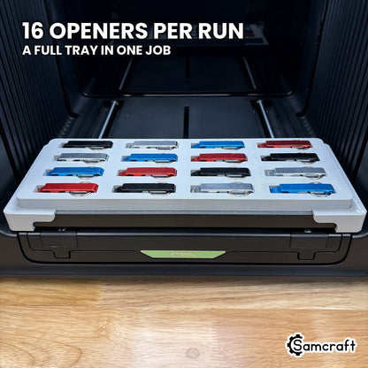 Top view of the Samcraft keychain bottle opener jig for the xTool Omni with all sixteen pockets filled, a full tray ready to run in one job.