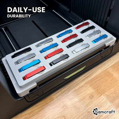 Samcraft keychain bottle opener jig in high-temperature rated plastic holding sixteen openers on the xTool Omni bed, built for daily use.