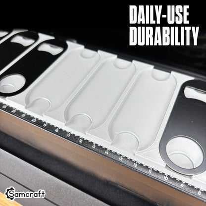 Oval Metal Bottle Opener Keychain Jig for the eufyMake E1 — close-up of the empty shaped pockets in the gray 3D-printed tray with built-in alignment ruler, highlighting daily-use durability.