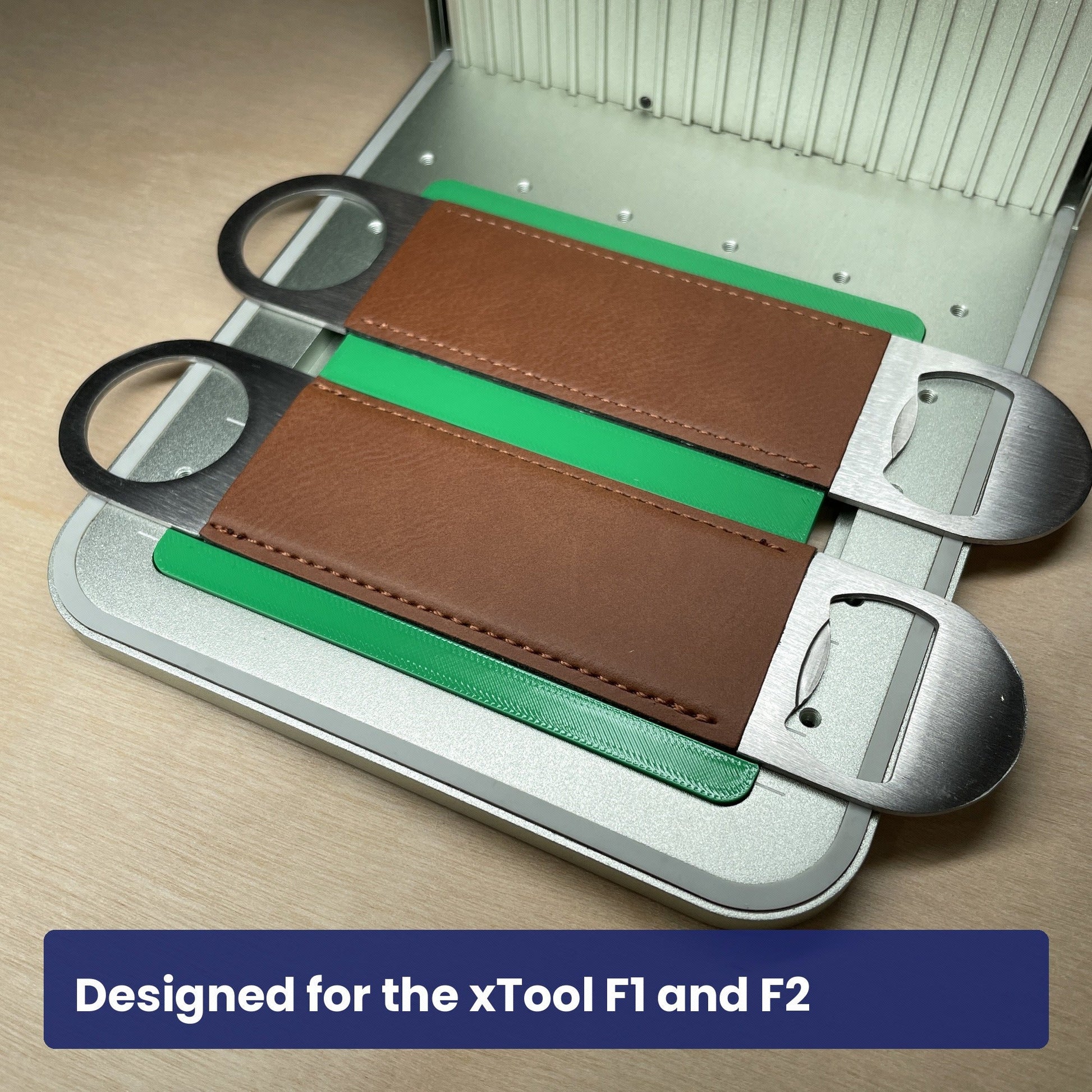 Samcraft large bottle opener jig seated in the xTool F1 base plate with brown leather openers in place.