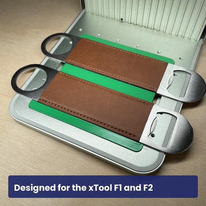 Samcraft large bottle opener jig seated in the xTool F1 base plate with brown leather openers in place.