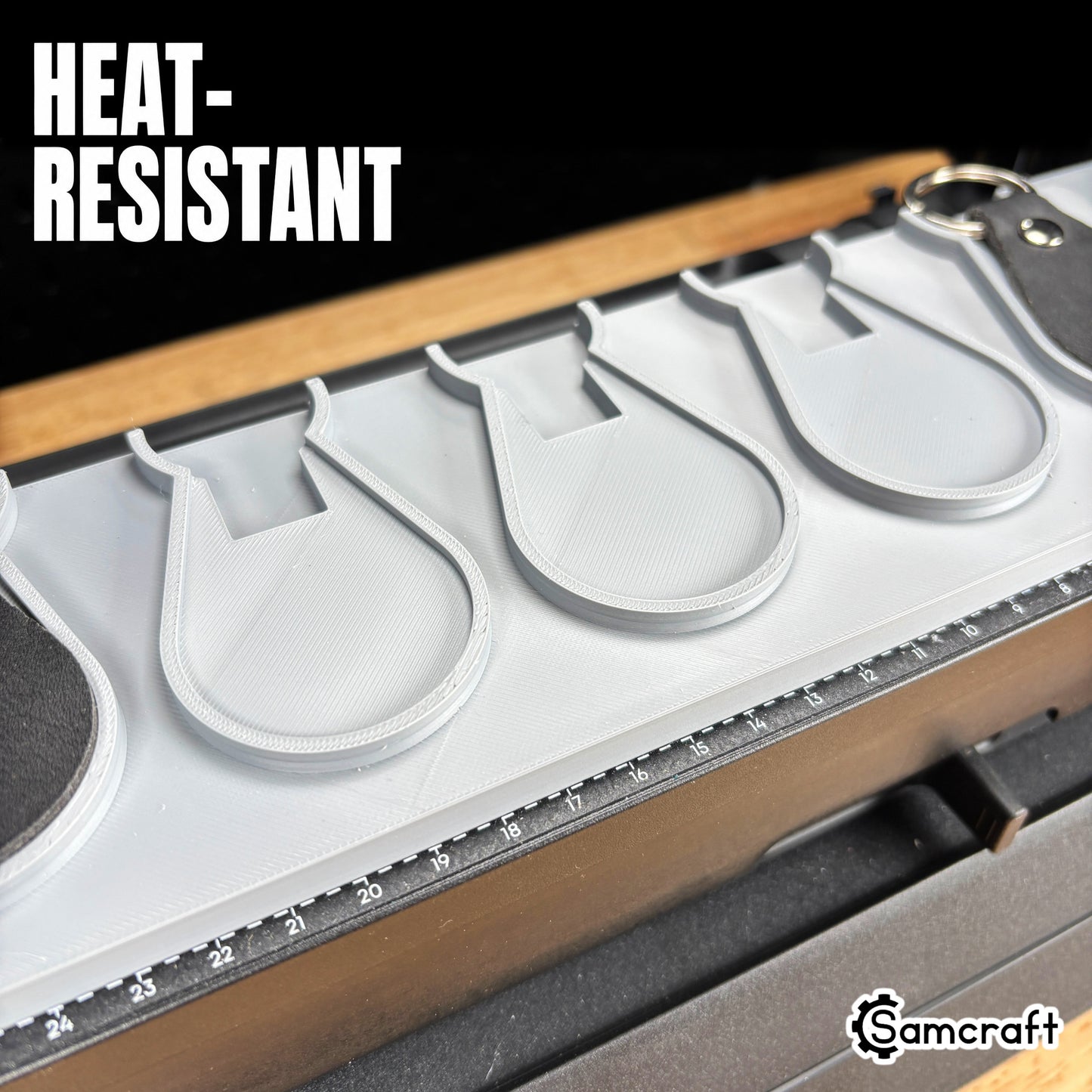 leather-key-fob-jig-eufymake-heat-resistant.jpg

Leather Key Fob Jig for the eufyMake E1 — close-up of the empty teardrop-shaped pockets in the gray 3D-printed tray with the built-in alignment ruler, highlighting the heat-resistant material.