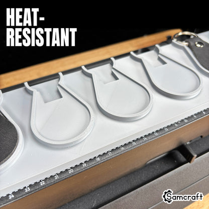 leather-key-fob-jig-eufymake-heat-resistant.jpg

Leather Key Fob Jig for the eufyMake E1 — close-up of the empty teardrop-shaped pockets in the gray 3D-printed tray with the built-in alignment ruler, highlighting the heat-resistant material.