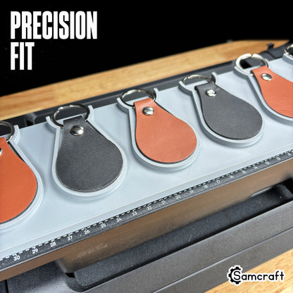 leather-key-fob-jig-eufymake-precision-fit.jpg

Leather Key Fob Jig for the eufyMake E1 — close-up showing teardrop leather key fobs in black and cognac sitting flush in the recessed pockets of the gray 3D-printed tray, with the built-in measurement ruler visible, demonstrating a precision fit.