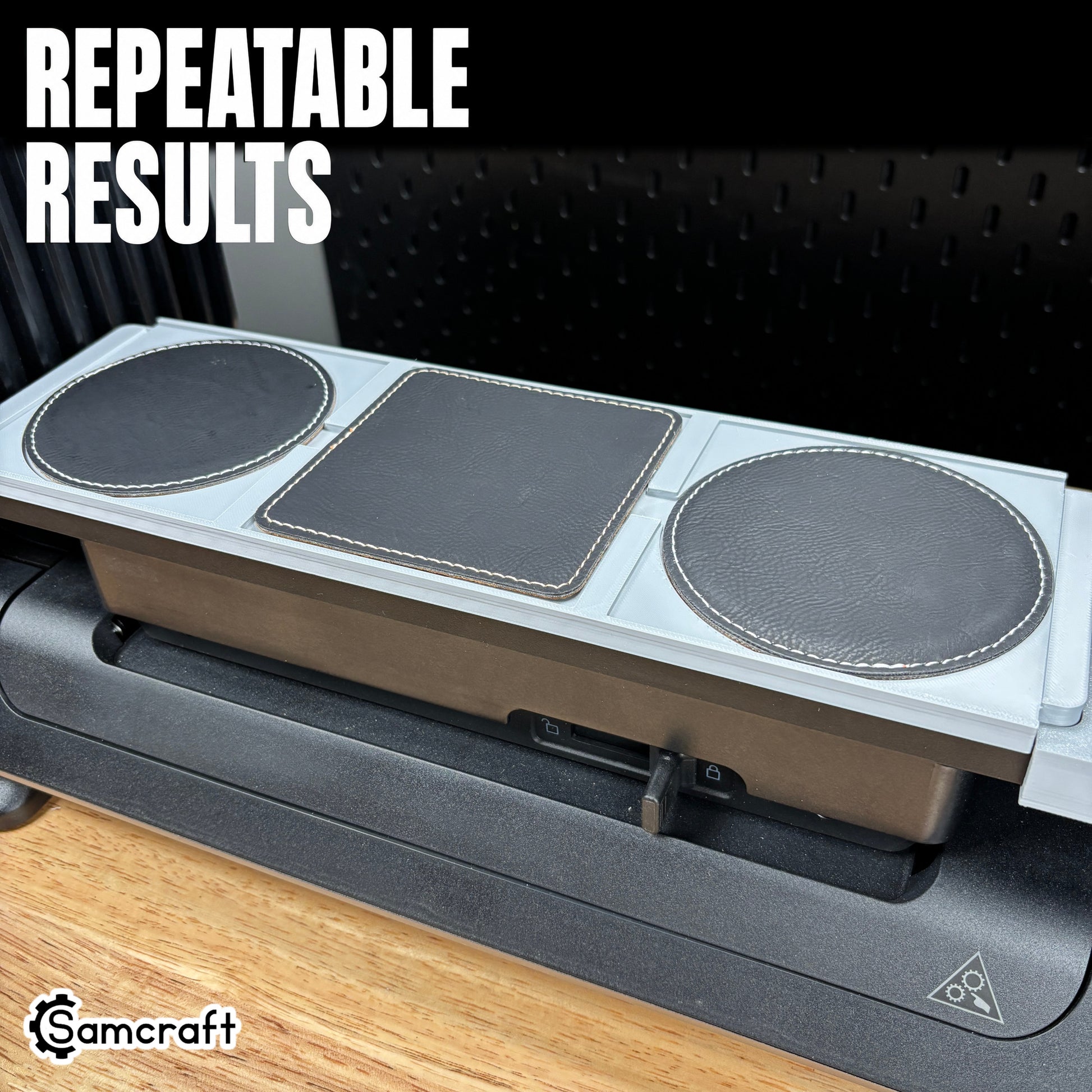 Black leather coasters with stitched edges seated in the Samcraft Leather/Silicone Drink Coaster Jig, demonstrating repeatable results on the eufyMake E1.
