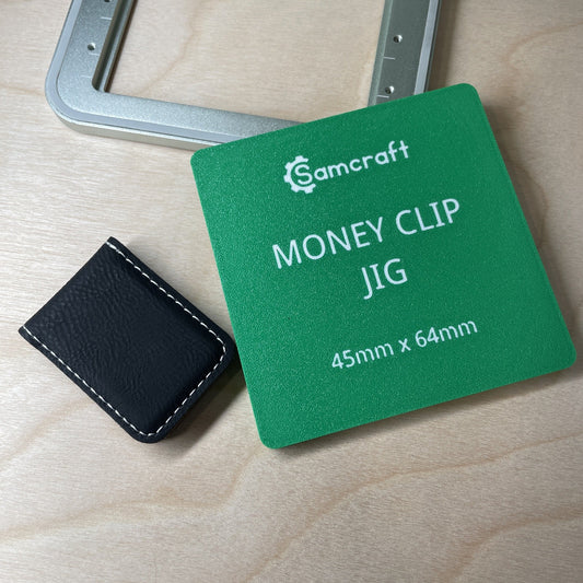 Samcraft leatherette money clip jig shown beside a black stitched leatherette money clip, with the size marked on the jig.