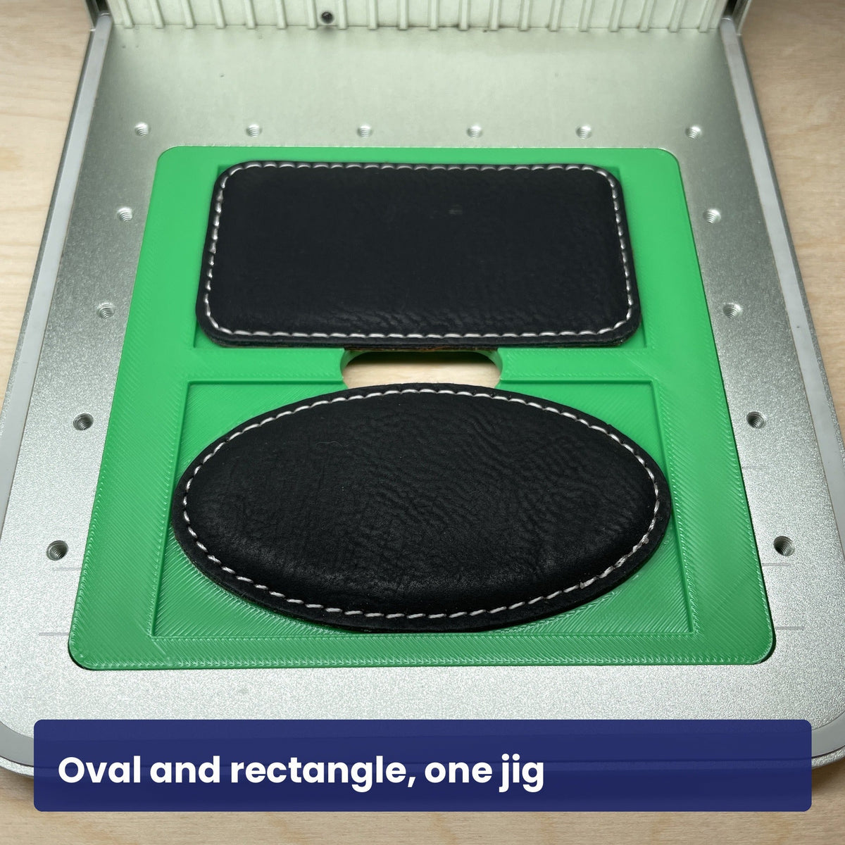 Samcraft magnetic badge jig holding a rectangular badge above an oval badge, showing both shapes it takes.