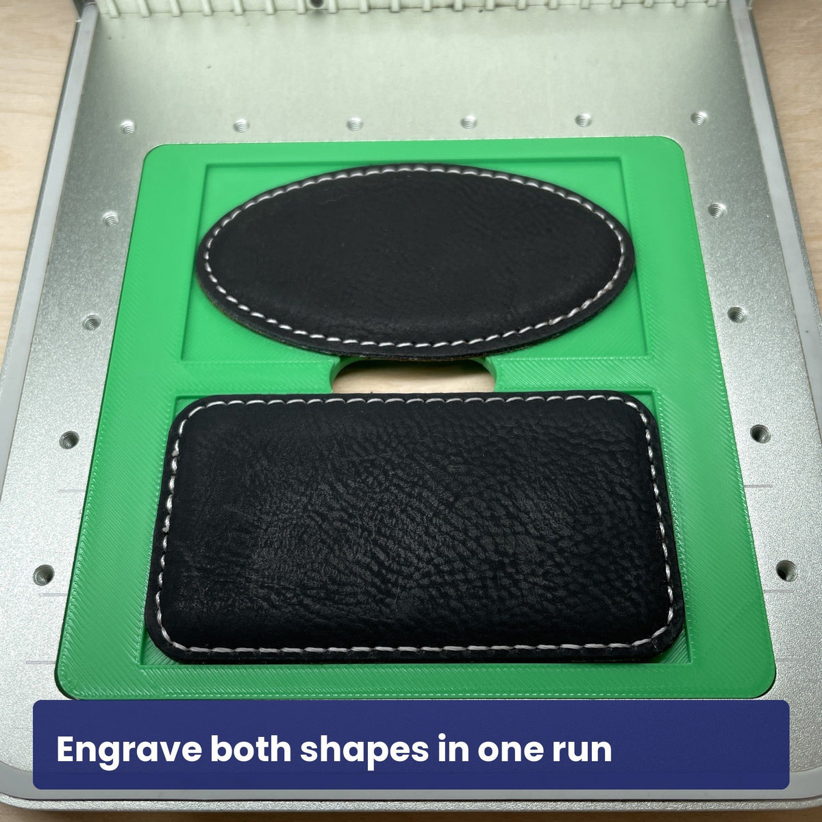 Samcraft magnetic badge jig with an oval and a rectangular badge in their recesses.