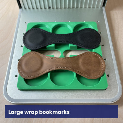 Large wrap leather bookmarks seated in the Samcraft magnetic bookmark jig.