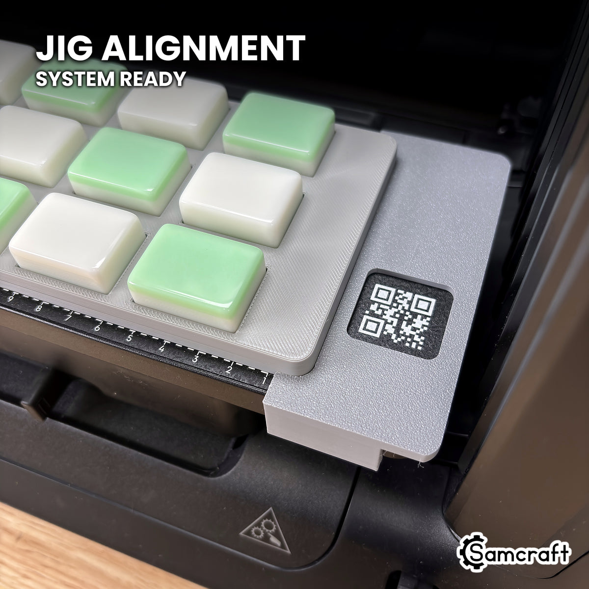 Close-up of the Samcraft mahjong tile jig seated against the eufyMake E1 Jig Alignment System end piece, with its QR code label visible.