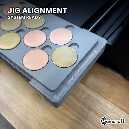 Close-up of the Samcraft 40mm metal coin jig seated on the Omni Jig Alignment System, the alignment system lettering visible along the edge.