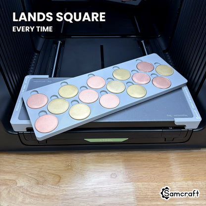 Samcraft 40mm metal coin jig dropped into the Omni Jig Alignment System, landing square and centered on the xTool Omni printer bed.