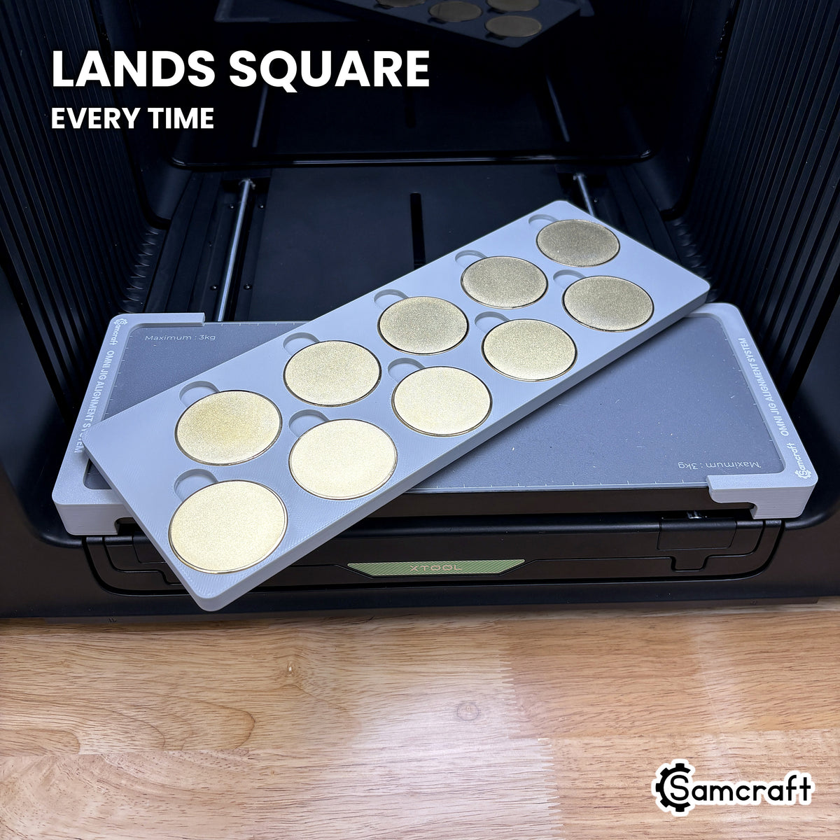 Samcraft 50mm metal coin jig dropped into the Omni Jig Alignment System, landing square and centered on the xTool Omni printer bed.