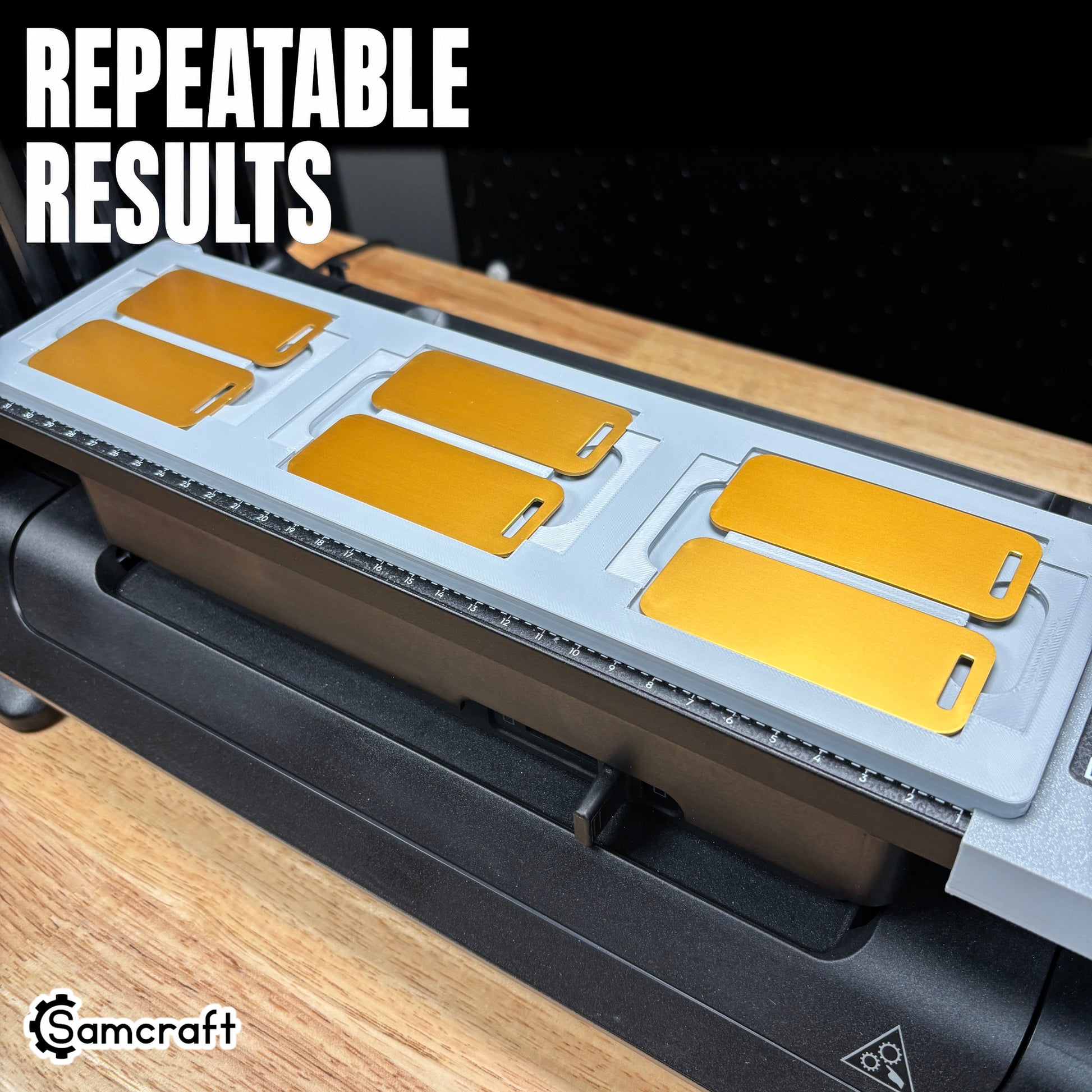 Samcraft Luggage Tag Jig holding six gold metal luggage tags in recessed pockets on the eufyMake E1 UV printer, demonstrating repeatable results.