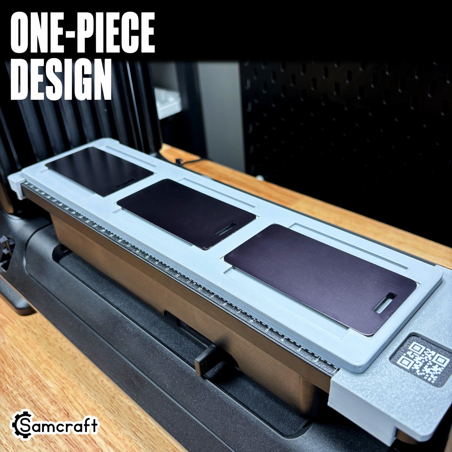 Samcraft Luggage Tag Jig holding six gold metal luggage tags in recessed pockets on the eufyMake E1 UV printer, demonstrating repeatable results.