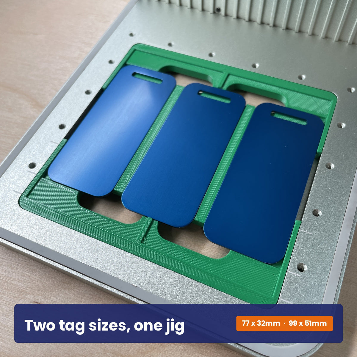 Luggage tag jig holding three blue tags, showing the two tag sizes the jig accepts.