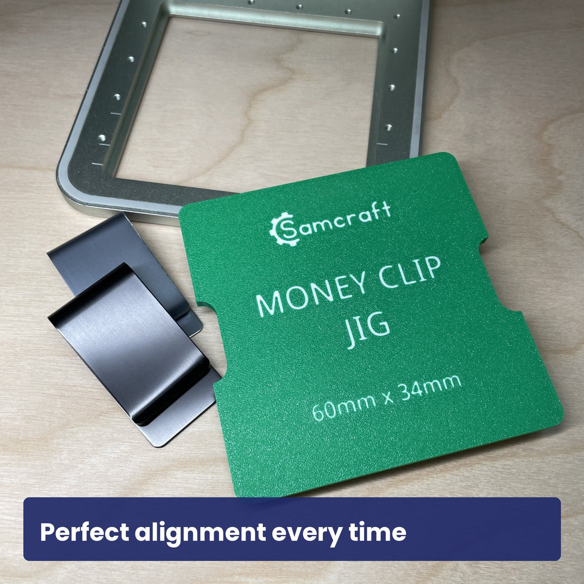 Empty Samcraft metal money clip jig in the xTool F1 bed, showing the recess.