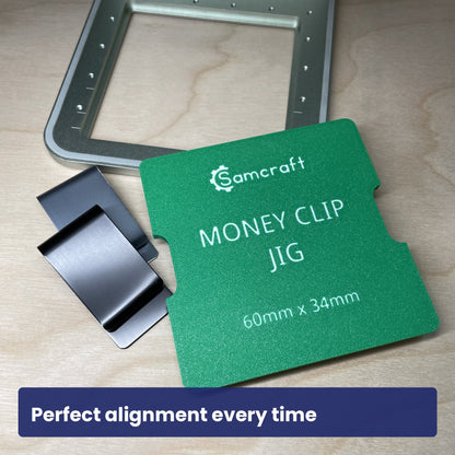 Empty Samcraft metal money clip jig in the xTool F1 bed, showing the recess.